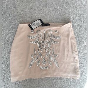New H&M jeweled neutral mini skirt